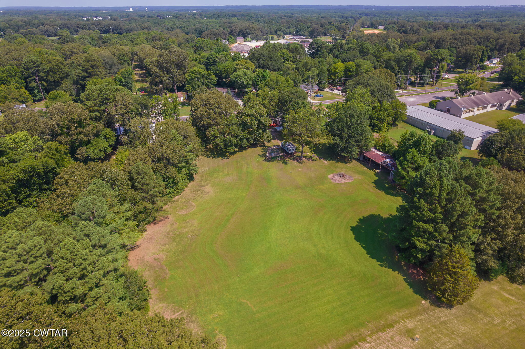 176 Old Denmark Road Jackson, TN 38301 - Photo 42 of 56 an aerial view of residential houses with outdoor space and trees all around