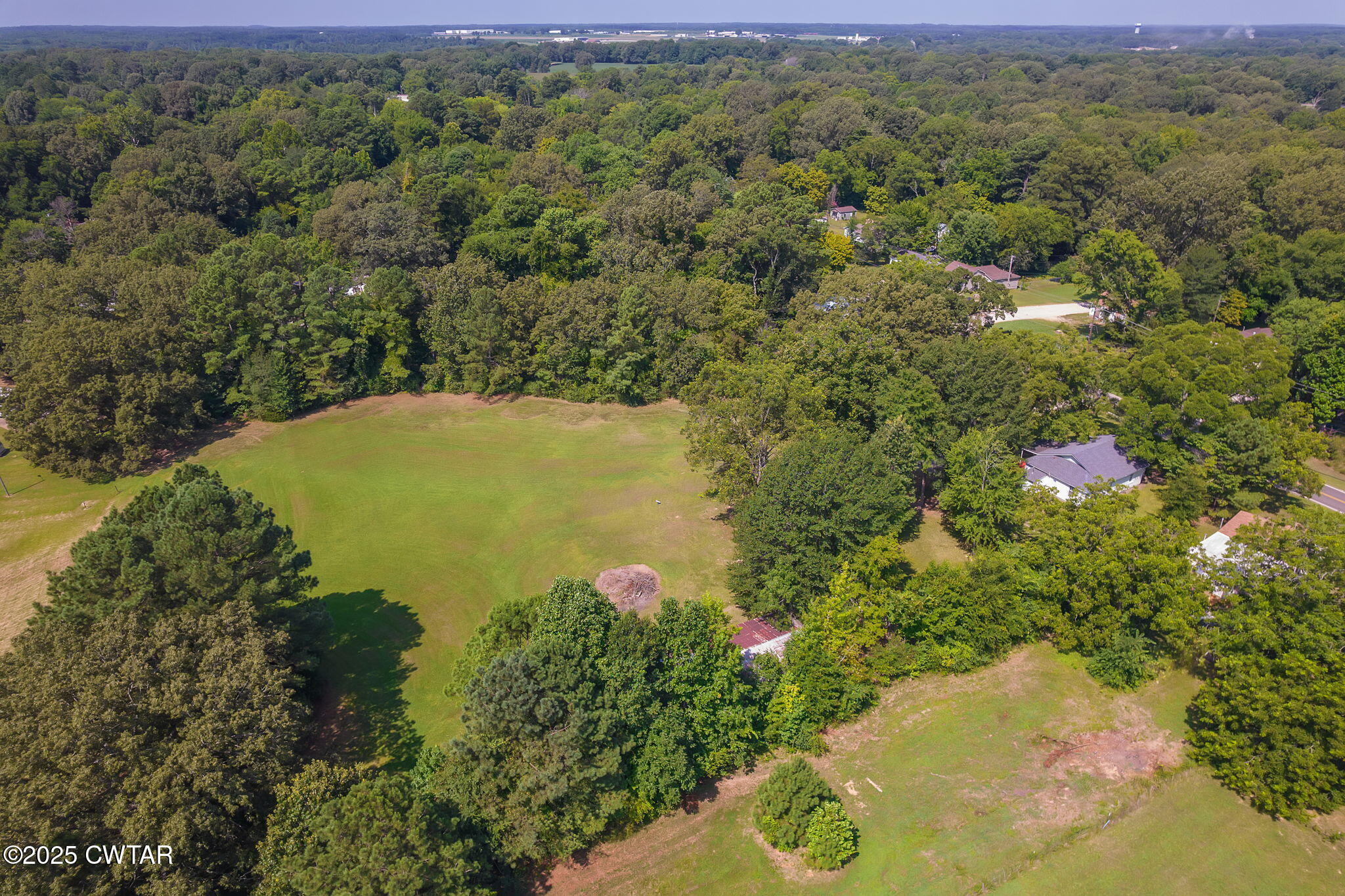 176 Old Denmark Road Jackson, TN 38301 - Photo 45 of 56 a view of a lake with a house
