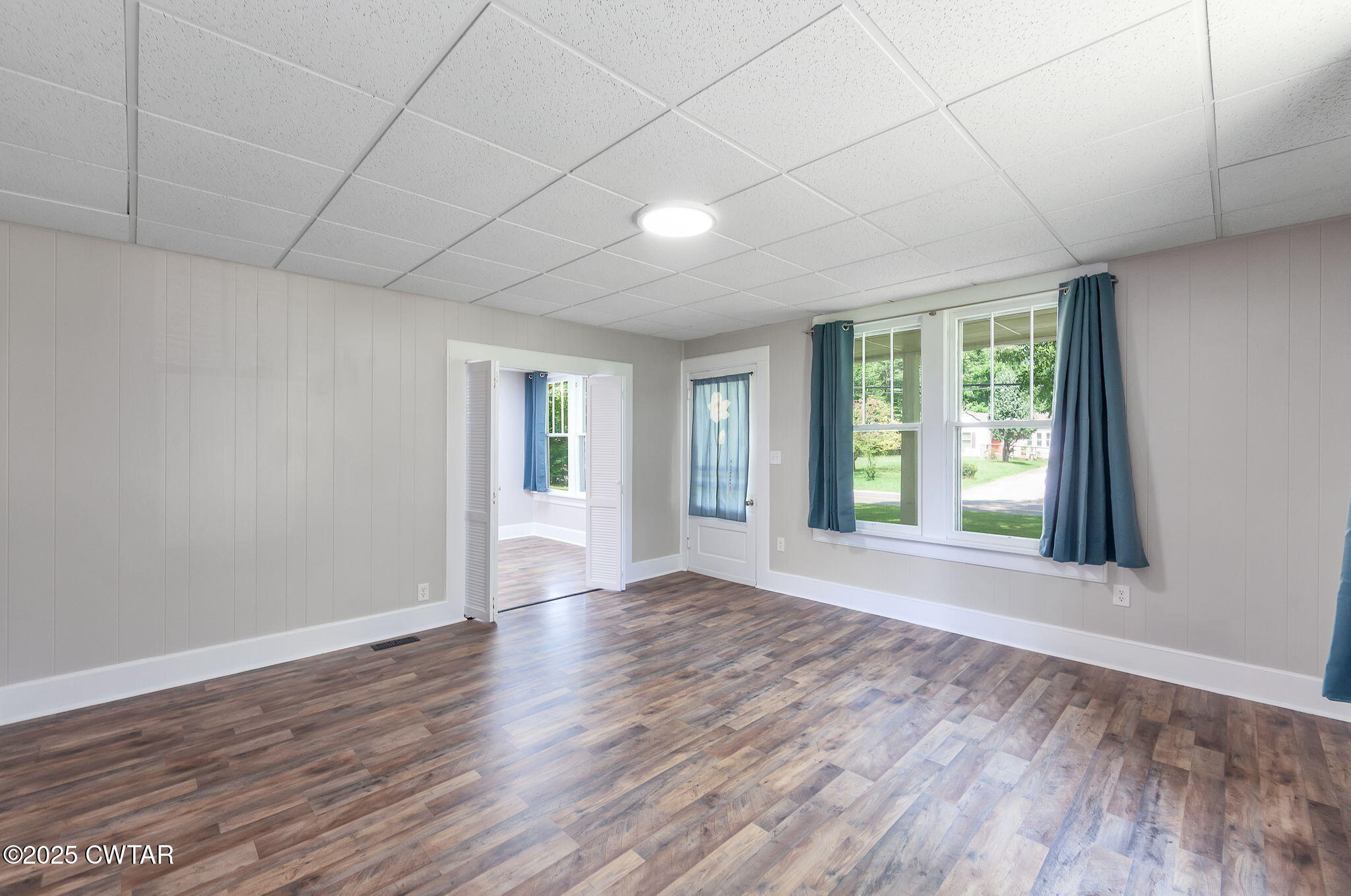 176 Old Denmark Road Jackson, TN 38301 - Photo 7 of 56 a view of an empty room with wooden floor and a window
