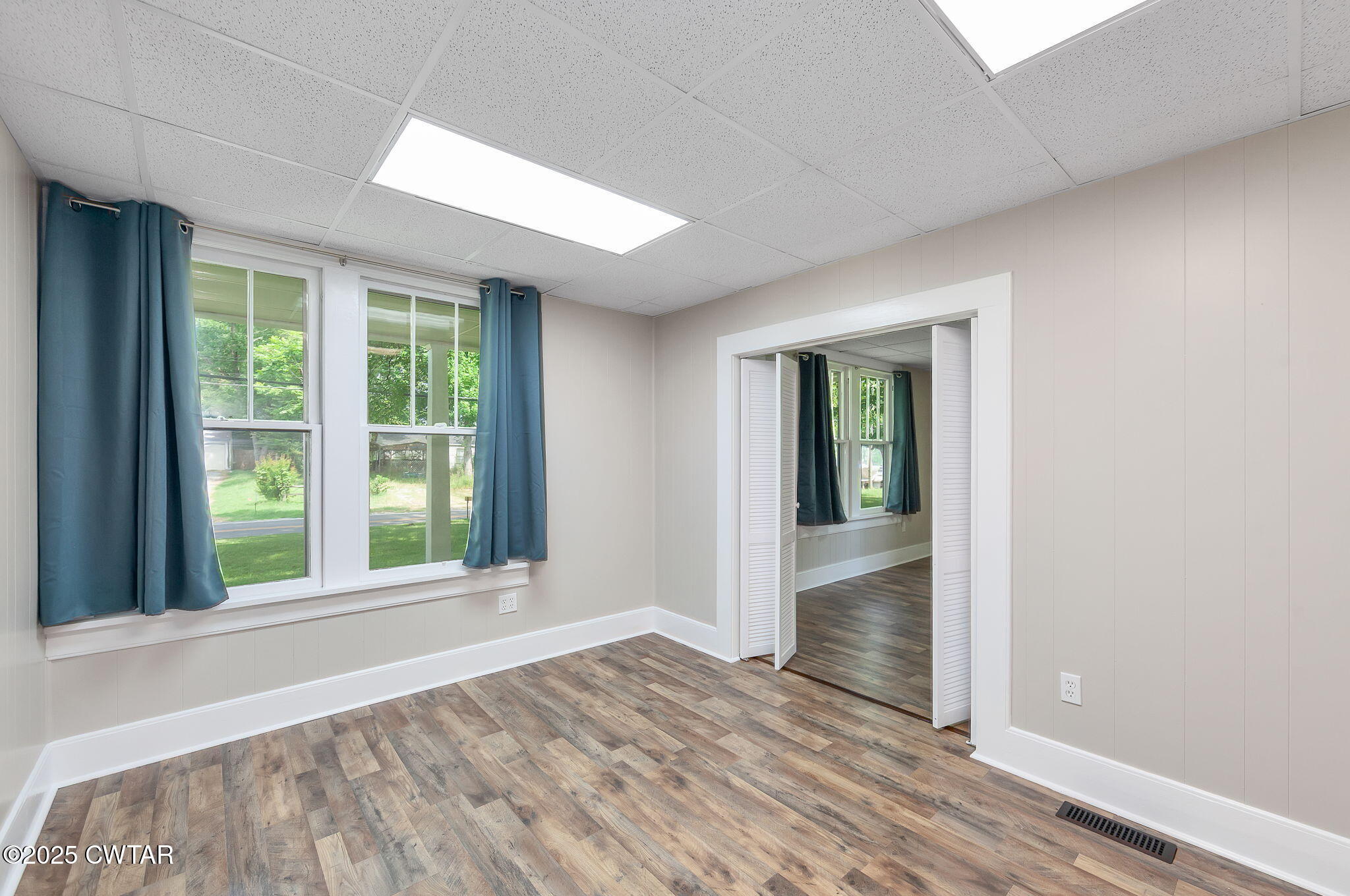 176 Old Denmark Road Jackson, TN 38301 - Photo 10 of 56 a view of an empty room with wooden floor and a window