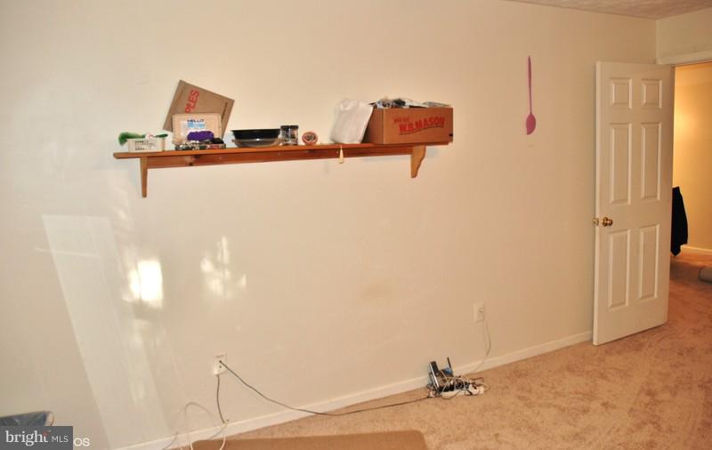 4868 Shellbark Road Owings Mills, MD 21117 - Photo 18 of 23 a room with a table and a couch