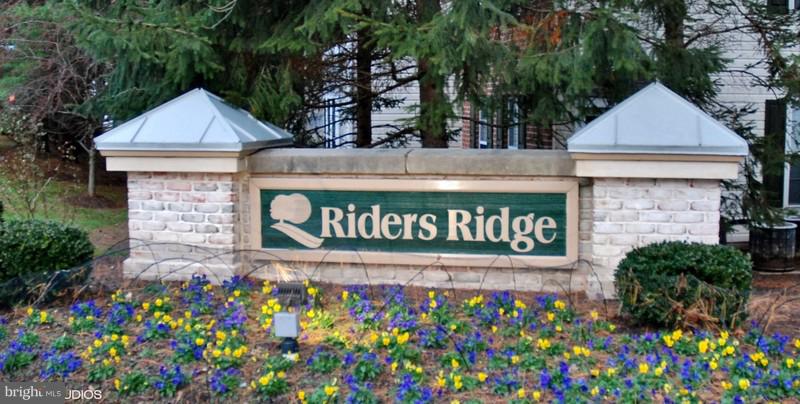 4868 Shellbark Road Owings Mills, MD 21117 - Photo 5 of 23 a sign that is in front of flowers