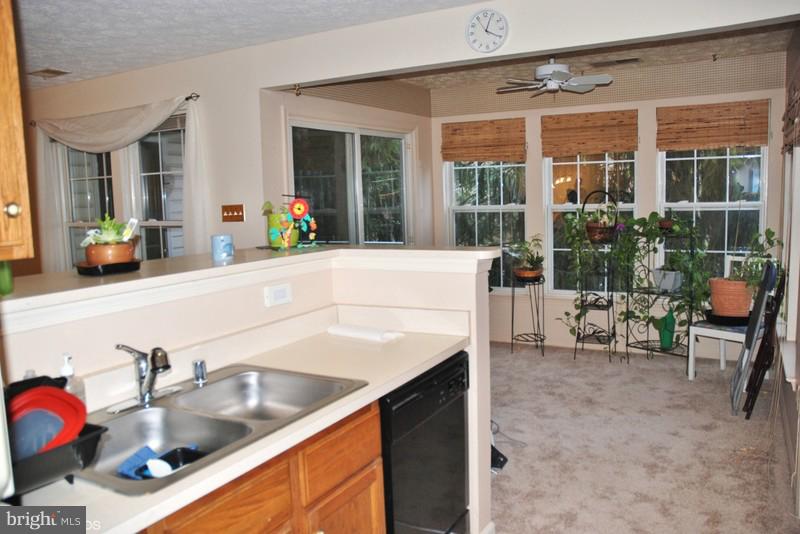 4868 Shellbark Road Owings Mills, MD 21117 - Photo 9 of 23 a kitchen with a sink and a stove top oven