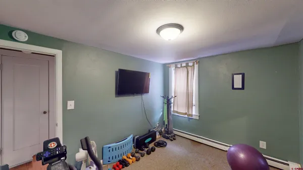 a bathroom with a sink toilet and mirror