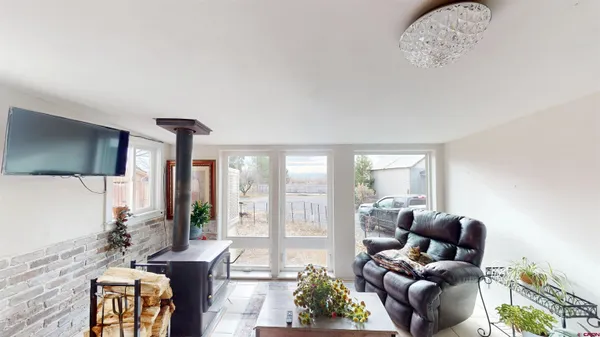 a view of a livingroom with furniture window and wooden floor
