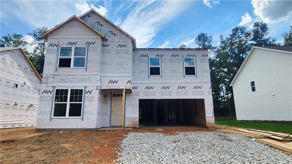 320 Silverleaf Trail Bethlehem, GA 30620 - Photo 2 of 20 a front view of a house with a yard and garage