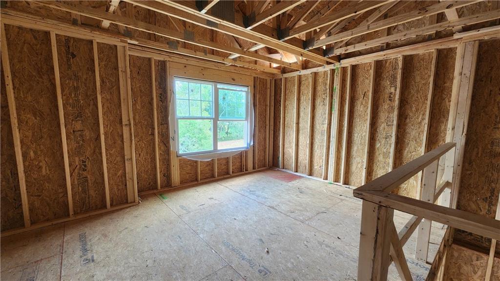 320 Silverleaf Trail Bethlehem, GA 30620 - Photo 7 of 20 a view of an empty room with a window