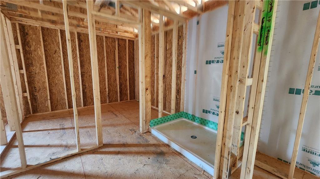 320 Silverleaf Trail Bethlehem, GA 30620 - Photo 9 of 20 a view of a hallway with wooden floor and staircase