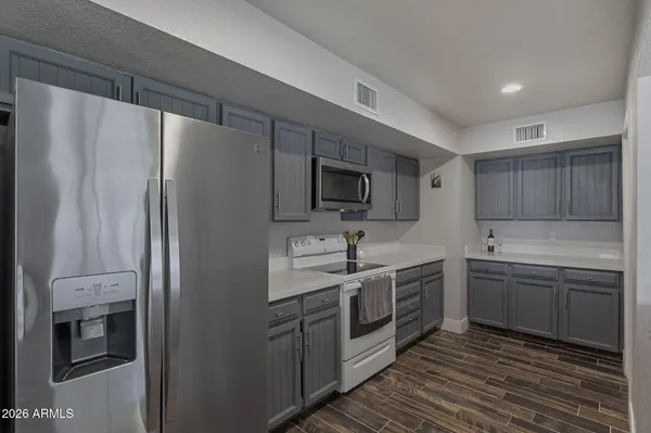a kitchen with sink and window