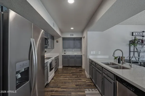 a view of a livingroom with workspace and a window