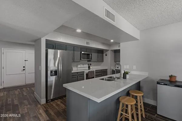 a work room with furniture and a ceiling fan