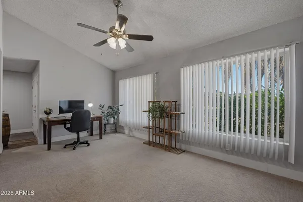 a view of a livingroom with furniture window and wooden floor