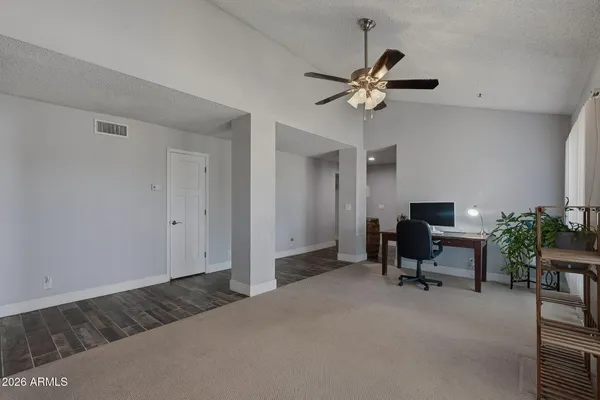 a bedroom with a bed and a table