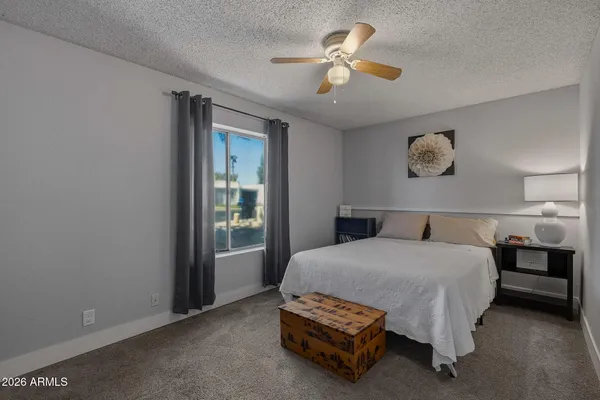 a balcony with furniture and wooden floor