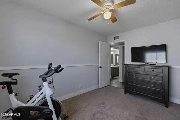 a view of a house with a swimming pool and a yard