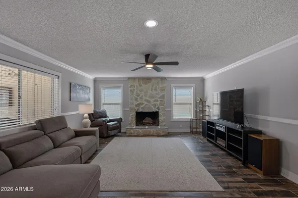 a living room with furniture and a fireplace