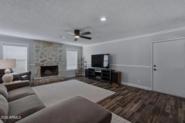a kitchen with stainless steel appliances a refrigerator sink and microwave