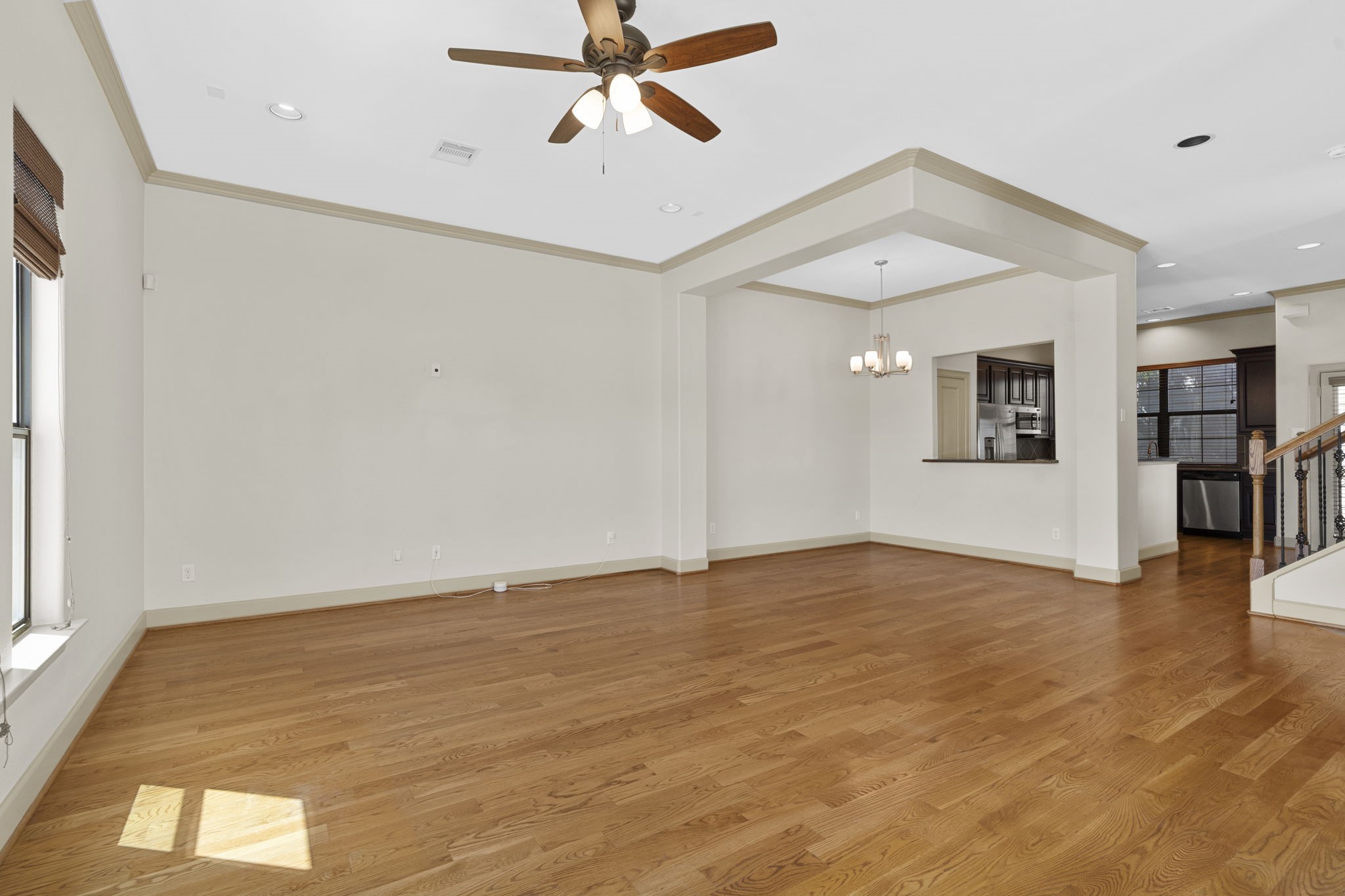 1218 Sandman Street Houston, TX 77007 - Photo 12 of 38 a view of an empty room with wooden floor and a window