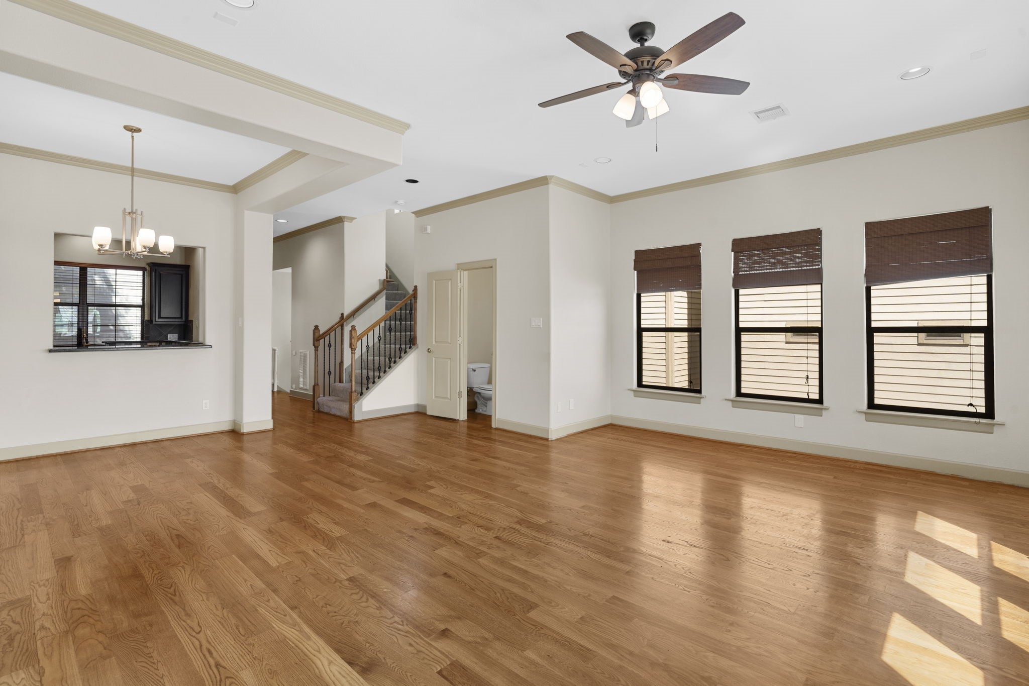 1218 Sandman Street Houston, TX 77007 - Photo 13 of 38 a view of an empty room with window and wooden floor