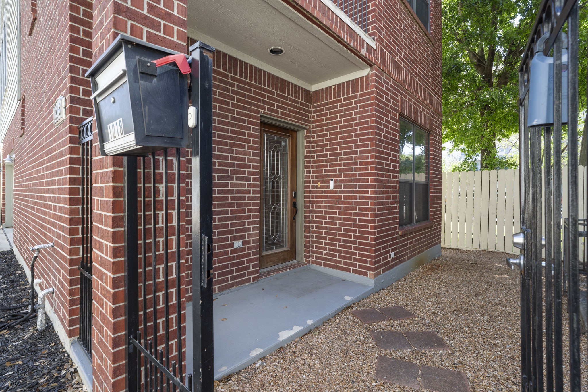 1218 Sandman Street Houston, TX 77007 - Photo 3 of 38 A gated front entry adds privacy and creates a warm, welcoming arrival every time you step through the door.
