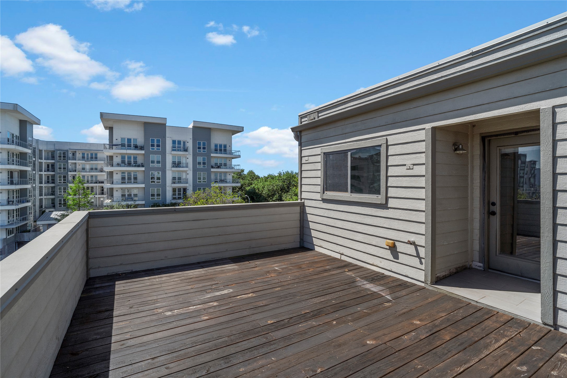 1218 Sandman Street Houston, TX 77007 - Photo 33 of 38 This expansive rooftop deck is ready for everything from slow mornings with coffee to lively evenings spent enjoying the energy of the city.