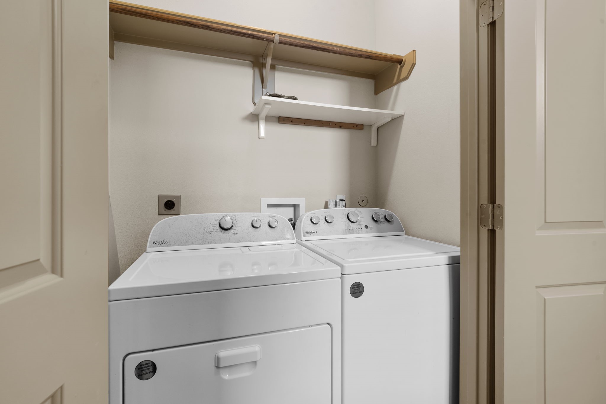1218 Sandman Street Houston, TX 77007 - Photo 9 of 38 The first-floor laundry area adds everyday convenience with built-in shelving, and the washer and dryer are included for an easy move-in.