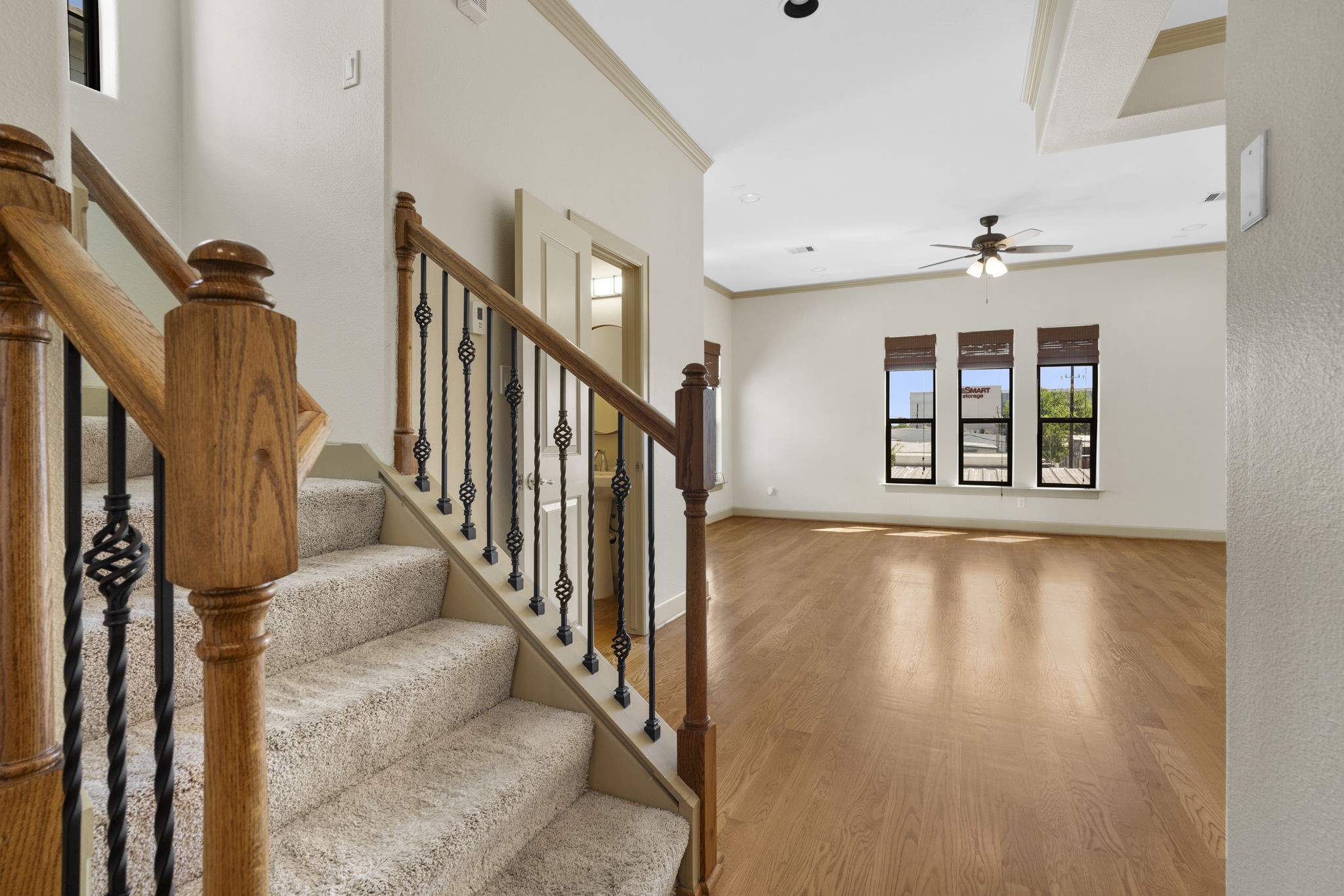1218 Sandman Street Houston, TX 77007 - Photo 10 of 38 Upstairs, the main living level opens to airy, inviting spaces designed for relaxing at home or hosting friends with ease.