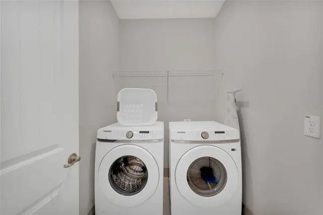 a utility room with dryer and washer