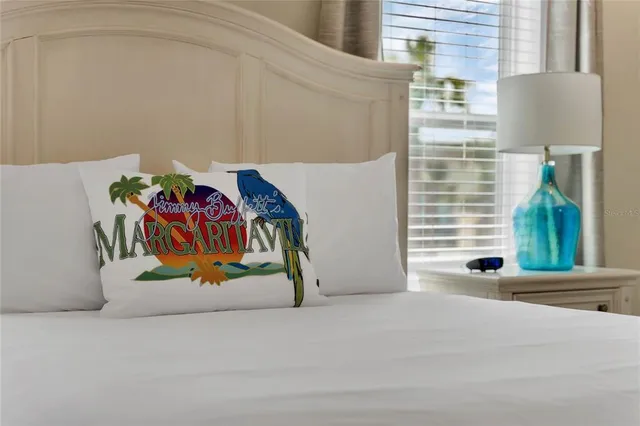 a view of a street with paintings on the wall