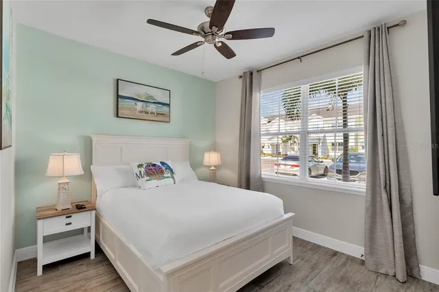 a bedroom with a large bed and a window