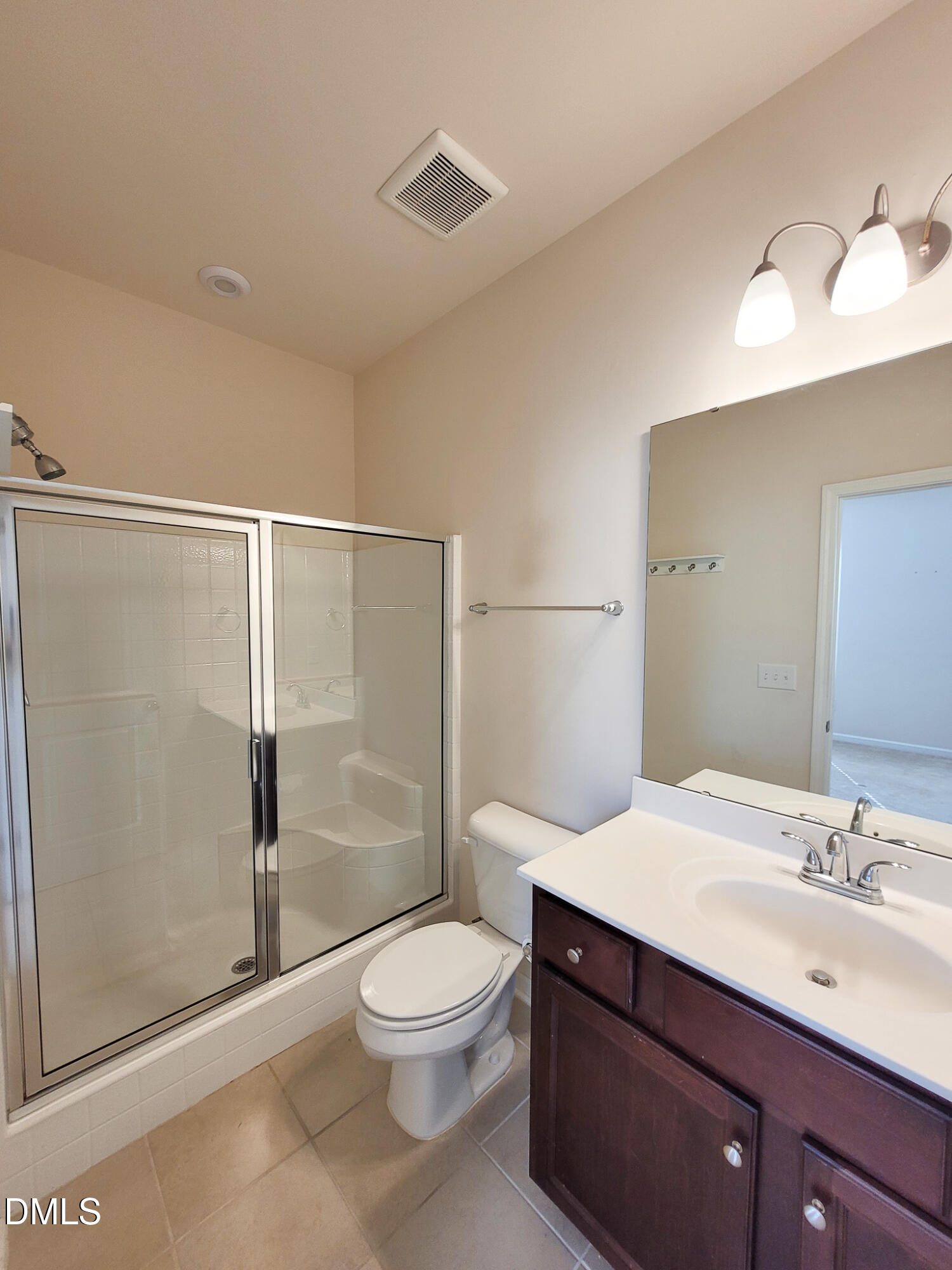 8951 Commons Townes Drive Raleigh, NC 27616 - Photo 21 of 40 a bathroom with a sink a toilet and shower