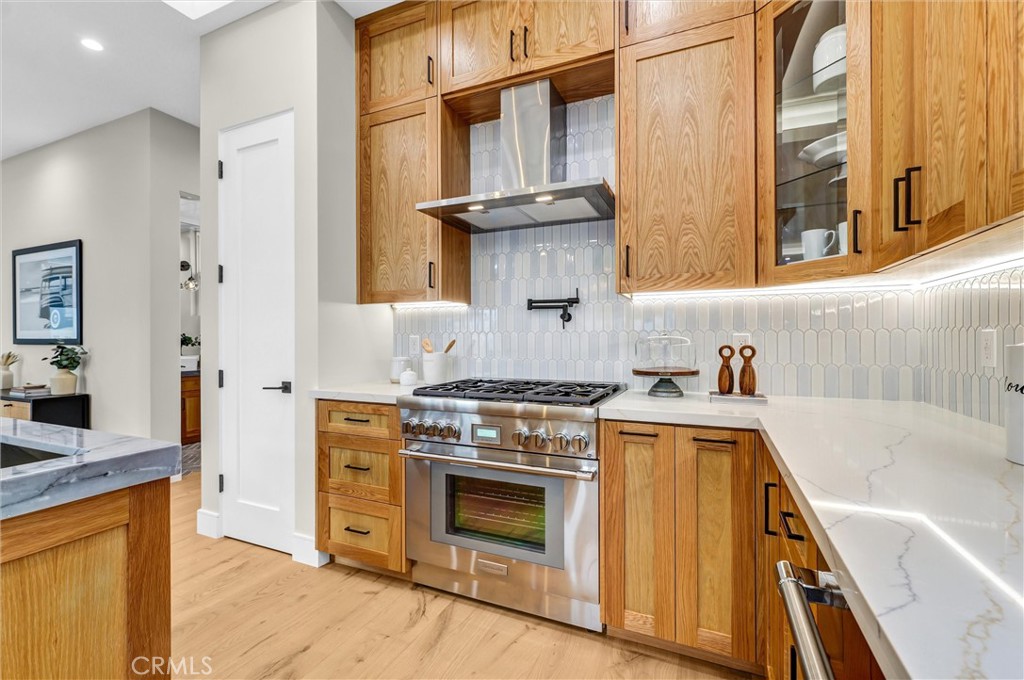 2016 Farrell Avenue, Unit B Redondo Beach, CA 90278 - Photo 11 of 51 a kitchen with stainless steel appliances granite countertop a stove and a sink