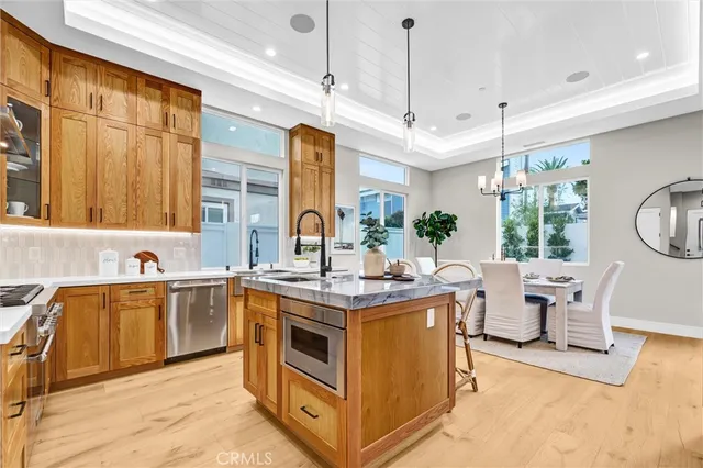 a kitchen with stainless steel appliances granite countertop a stove and a sink