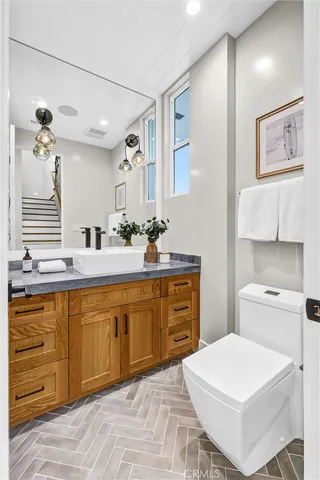 a spacious bathroom with a sink double vanity and a mirror