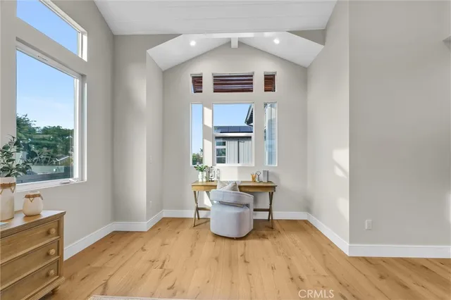 a view of work space with wooden floor and furniture