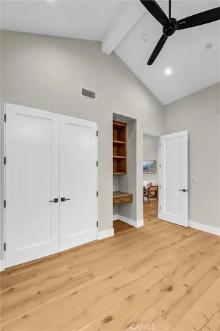 a view of room with wooden floor and window