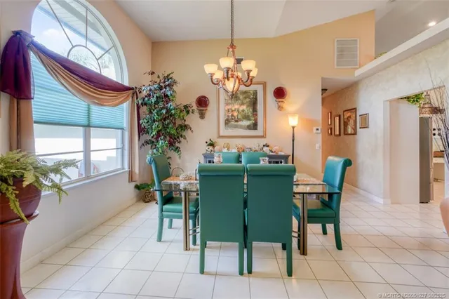 a dining room with furniture and window