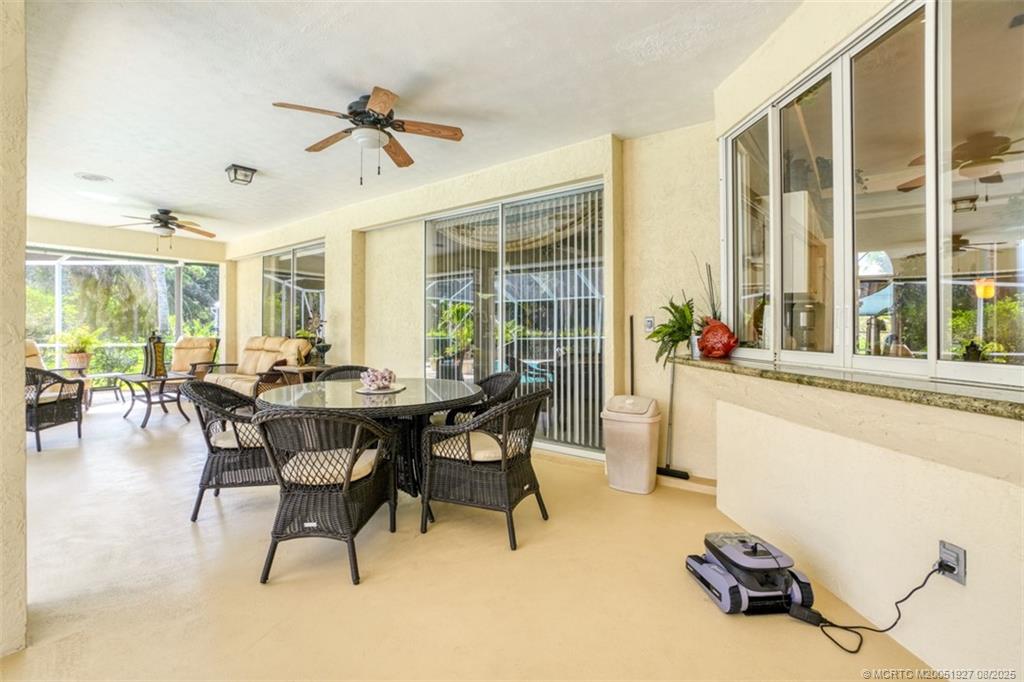 1171 Southeast Buttonwood Circle Stuart, FL 34997 - Photo 7 of 36 a view of a dining room with furniture window and outside view