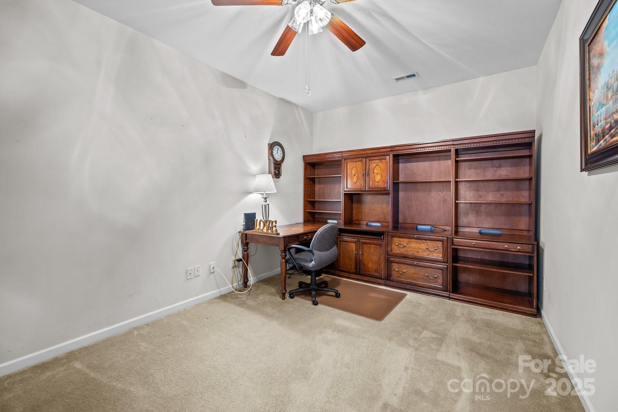 1668 Onyx Ridge, Unit 116 Fort Mill, SC 29708 - Photo 5 of 20 a view of a workspace with furniture