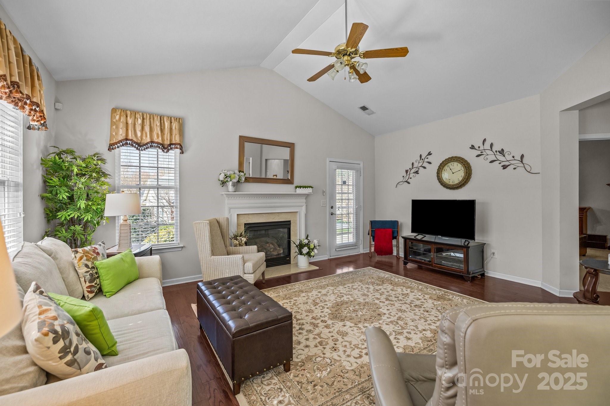 1668 Onyx Ridge, Unit 116 Fort Mill, SC 29708 - Photo 9 of 20 a living room with furniture a fireplace and a flat screen tv