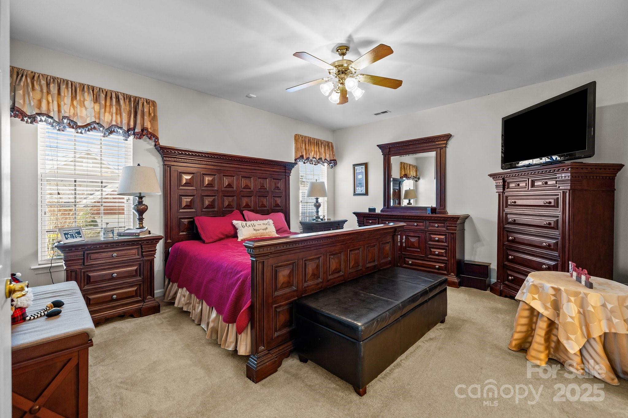 1668 Onyx Ridge, Unit 116 Fort Mill, SC 29708 - Photo 10 of 20 a bedroom with a bed and a flat screen tv