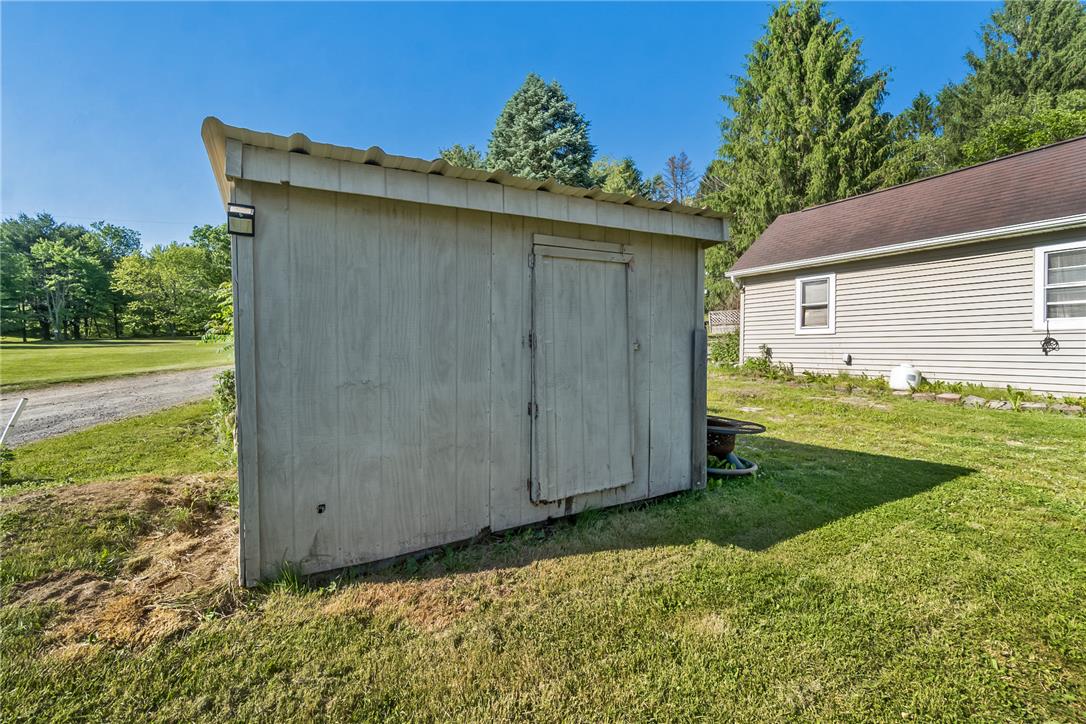 331 East Lizard Creek Road Lehighton, PA 18235 - Photo 12 of 37 A quaint shed offers practical storage solutions amidst a verdant outdoor setting.