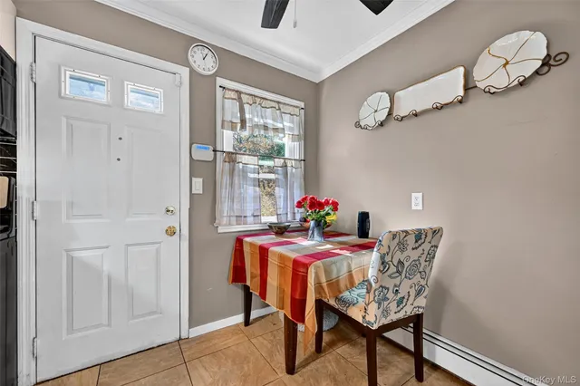 a dining room with furniture and window