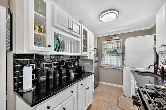 a kitchen with a refrigerator and a stove