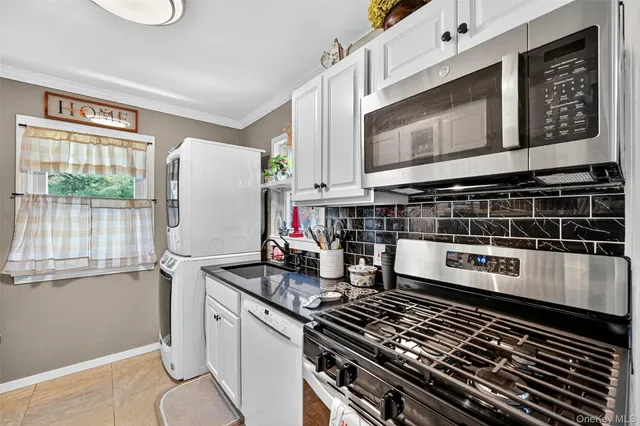 a kitchen with a stove and a microwave