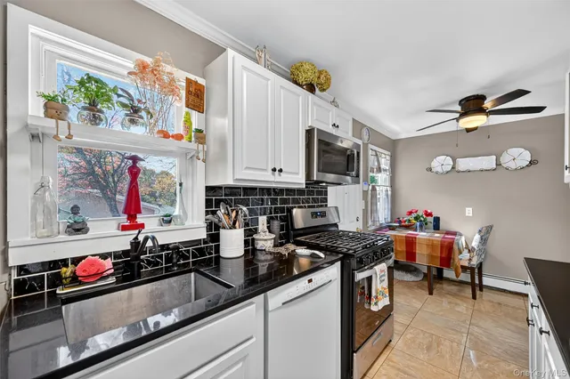 a kitchen that has a sink and a stove