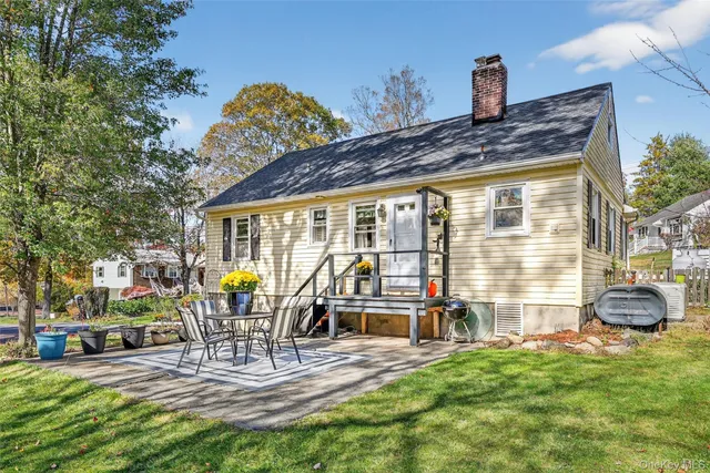 a house view with outdoor seating space
