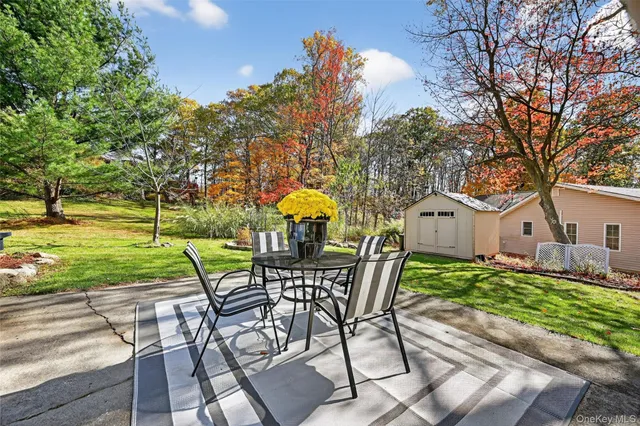 a view of a chairs and table in the patio