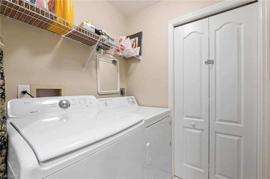 26991 Clarkston Drive, Unit 8202 Bonita Springs, FL 34135 - Photo 13 of 20 a utility room with dryer and washer