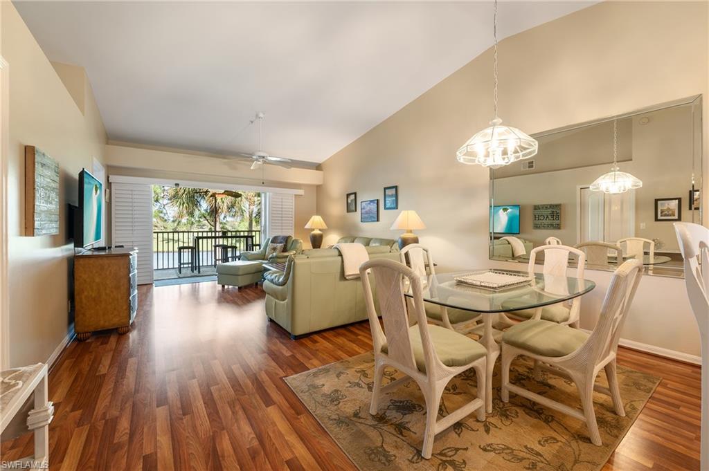26991 Clarkston Drive, Unit 8202 Bonita Springs, FL 34135 - Photo 7 of 20 a view of a dining room with furniture window and wooden floor